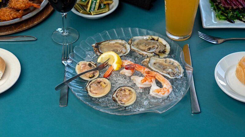 Clams appetizer topped with shrimp