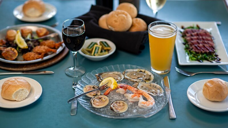 Multiple appetizers with focus on shrimp and clams appetizer